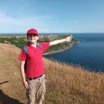 student pointing out to the coast